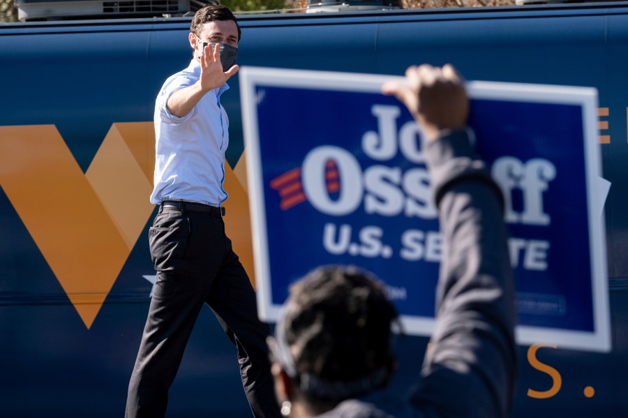 In this Dec. 21, 2020, file photo Democratic U.S. Senate challenger Jon Ossoff during a rally in Columbus, Ga. with Vice President-elect Kamala Harris and fellow Democratic U.S. Senate challenger the Rev. Raphael Warnock. (Ben Gray/AP Photo)