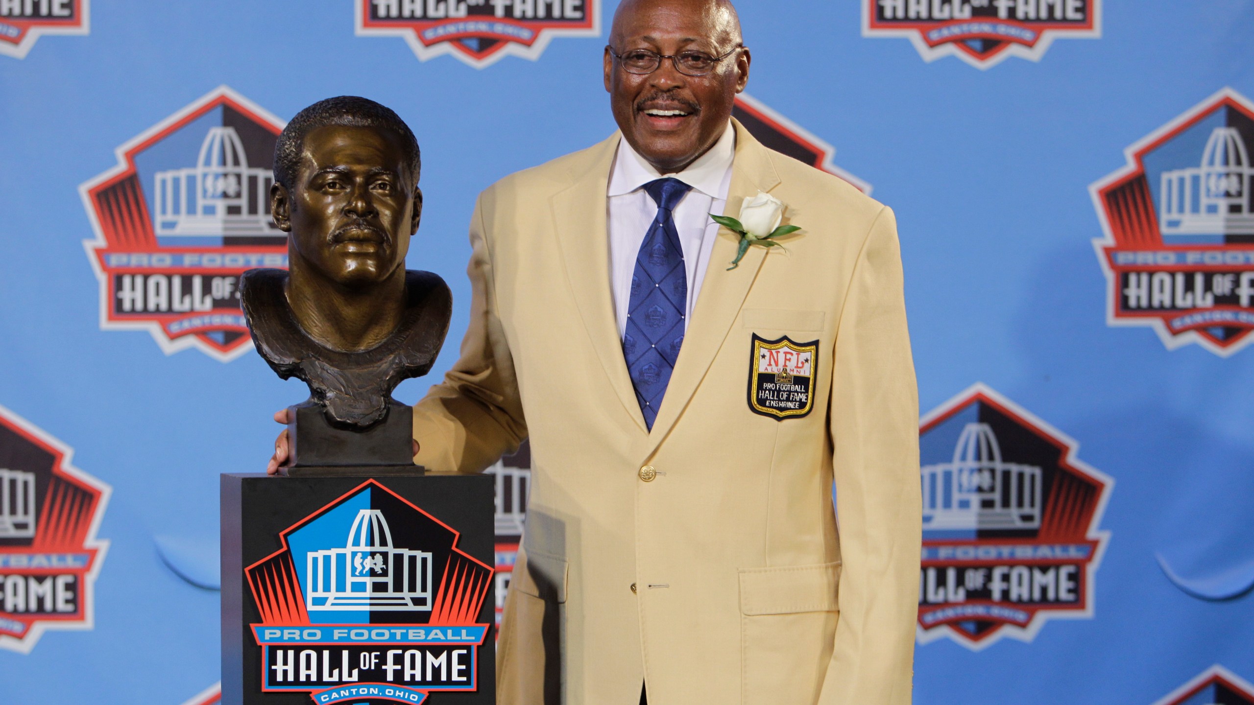 In this Aug. 7, 2010 file photo, Floyd Little poses with his bust after enshrinement in the Pro Football Hall of Fame in Canton, Ohio. (AP Photo/Mark Duncan, File)