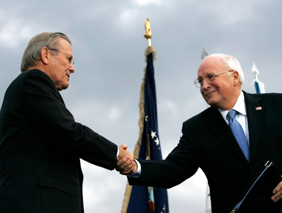 In this Dec. 15, 2006, file photo, outgoing Defense Secretary Donald H. Rumsfeld, left, shakes hands with Vice President Dick Cheney during an Armed Forces Full Honor Review for Rumsfeld at the Pentagon. (AP Photo/Pablo Martinez Monsivais, File)