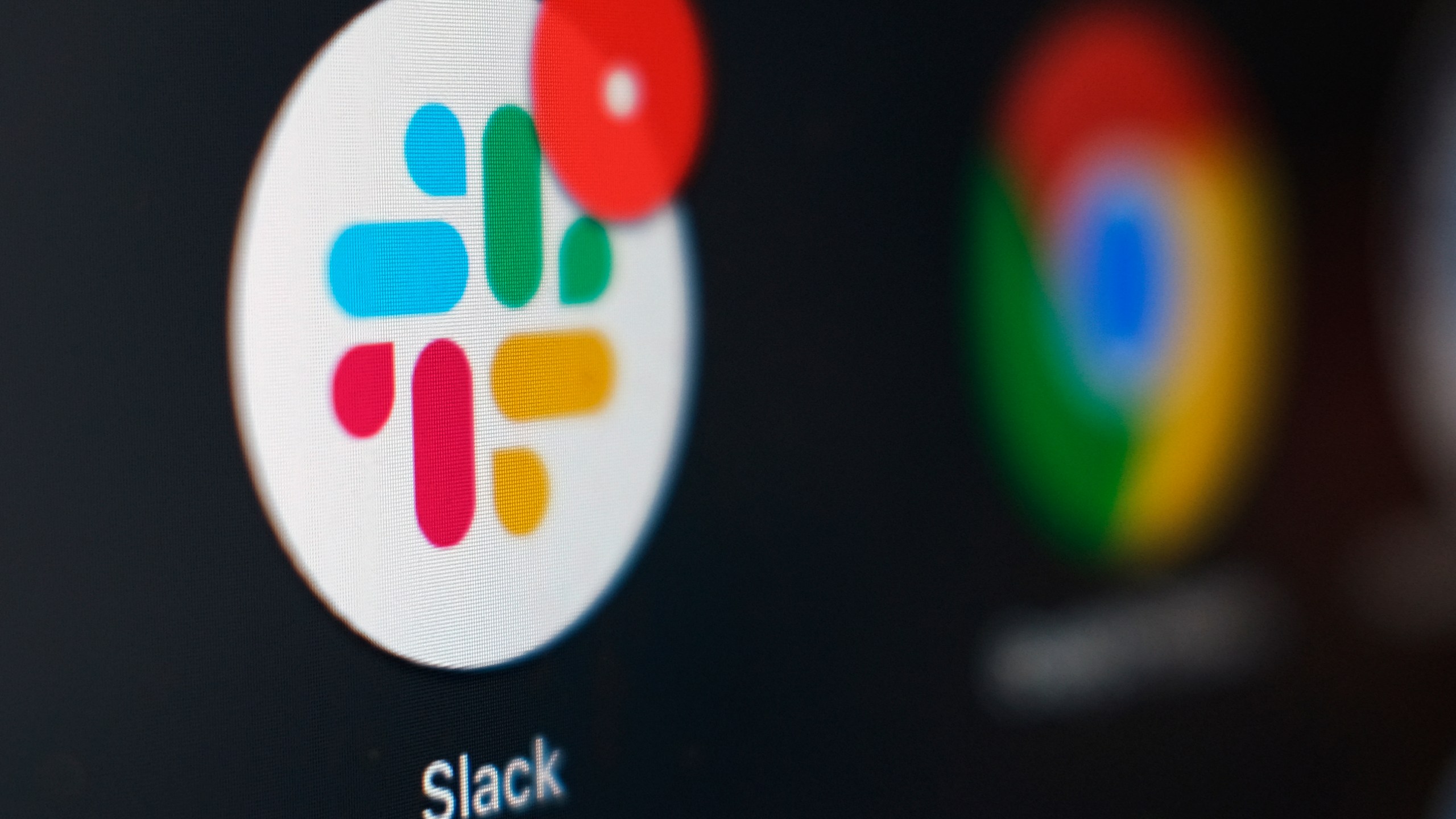 This Dec. 2, 2020, file photo shows the Slack app icon being displayed on a computer screen in Tokyo. (AP Photo/Kiichiro Sato, File)