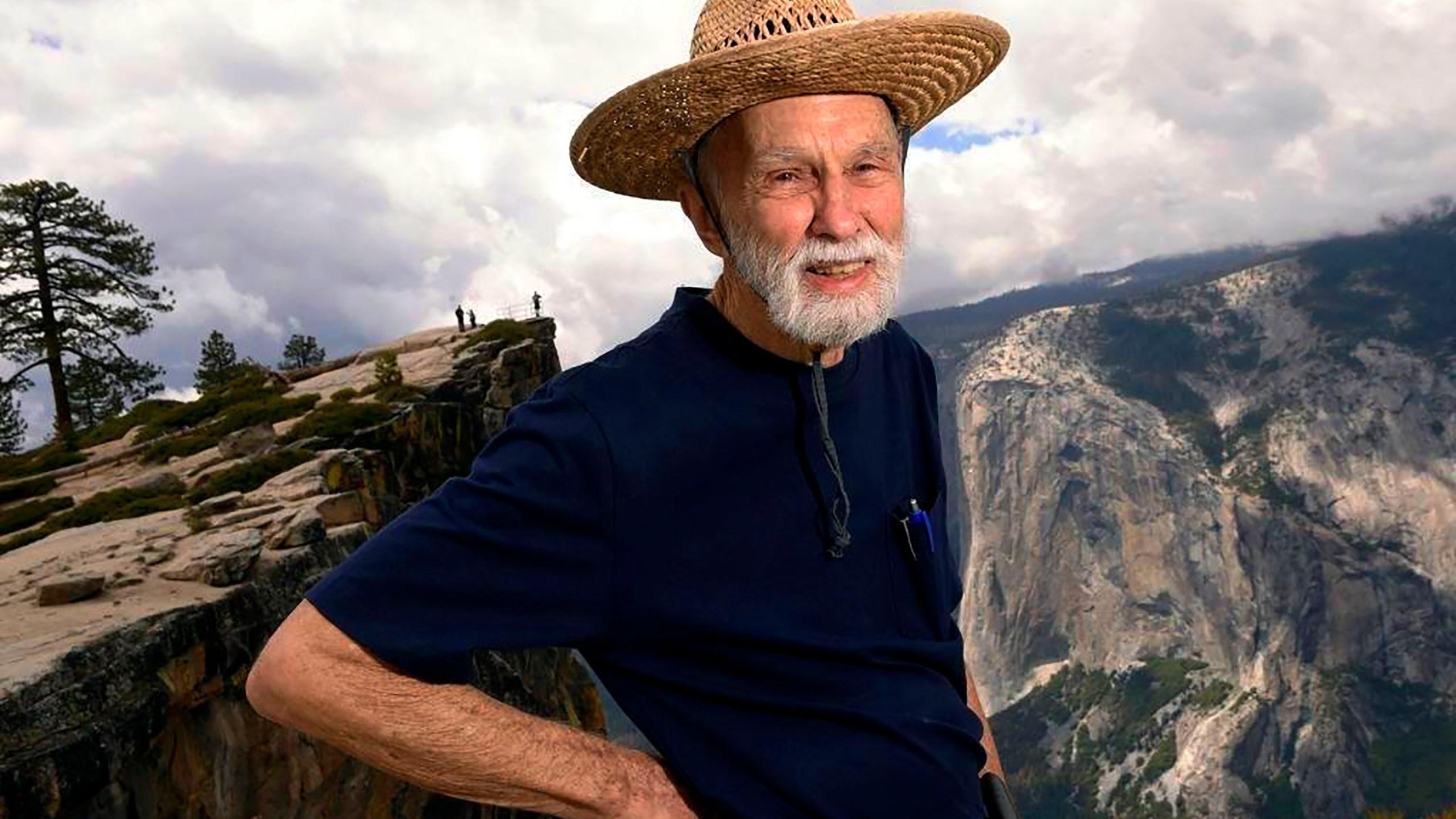 George Whitmore, one of the three men on the first team to climb El Capitan in Yosemite Valley, is seen on a hike to Taft Point with El Capitan in the background across Yosemite Valley on May 26, 2016. (Eric Paul Zamora/Fresno Bee via AP)