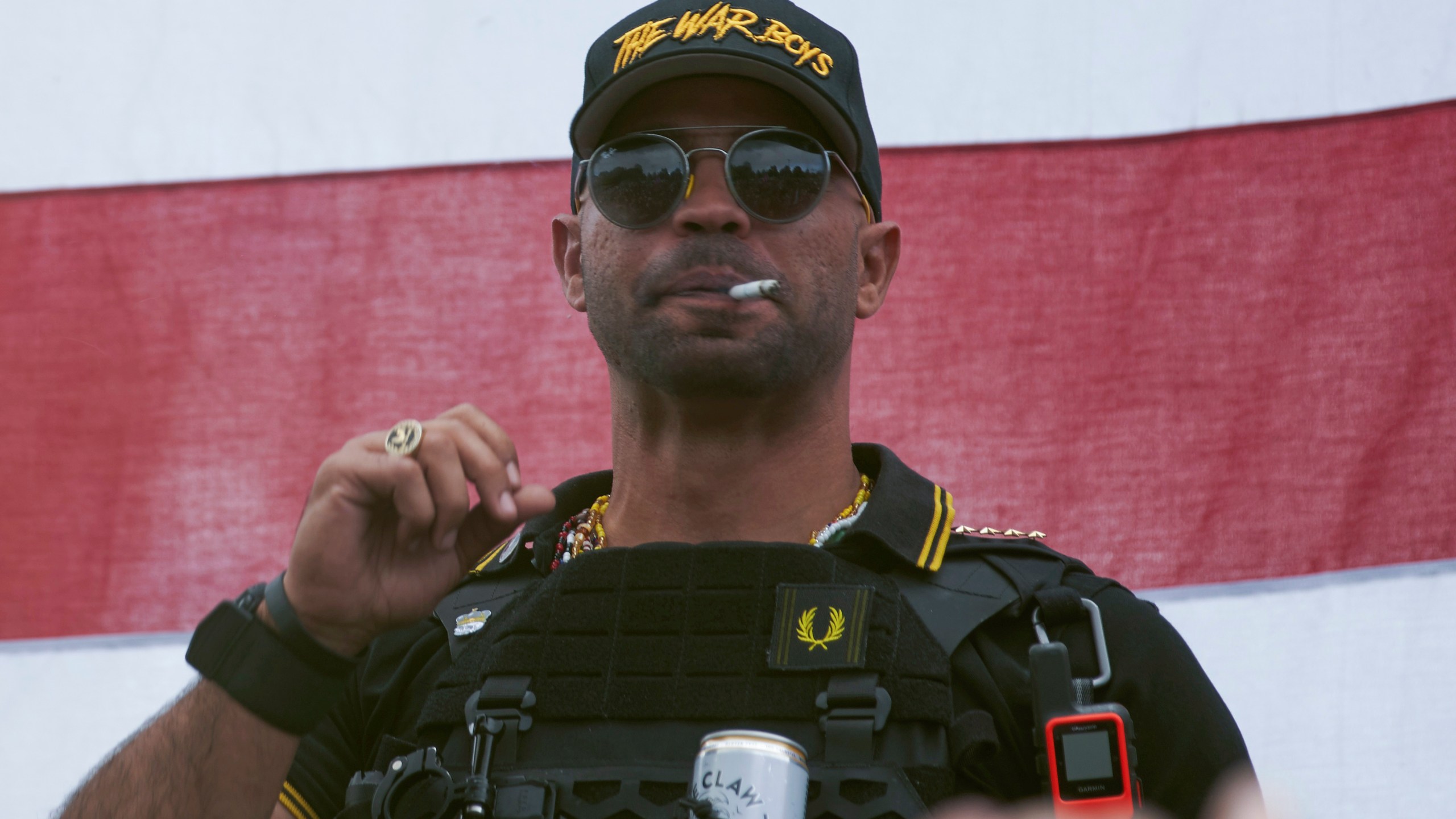 Proud Boys leader Henry "Enrique" Tarrio wears a hat that says The War Boys during a rally in Portland, Ore., on Sept. 26, 2020. (Allison Dinner / Associated Press)