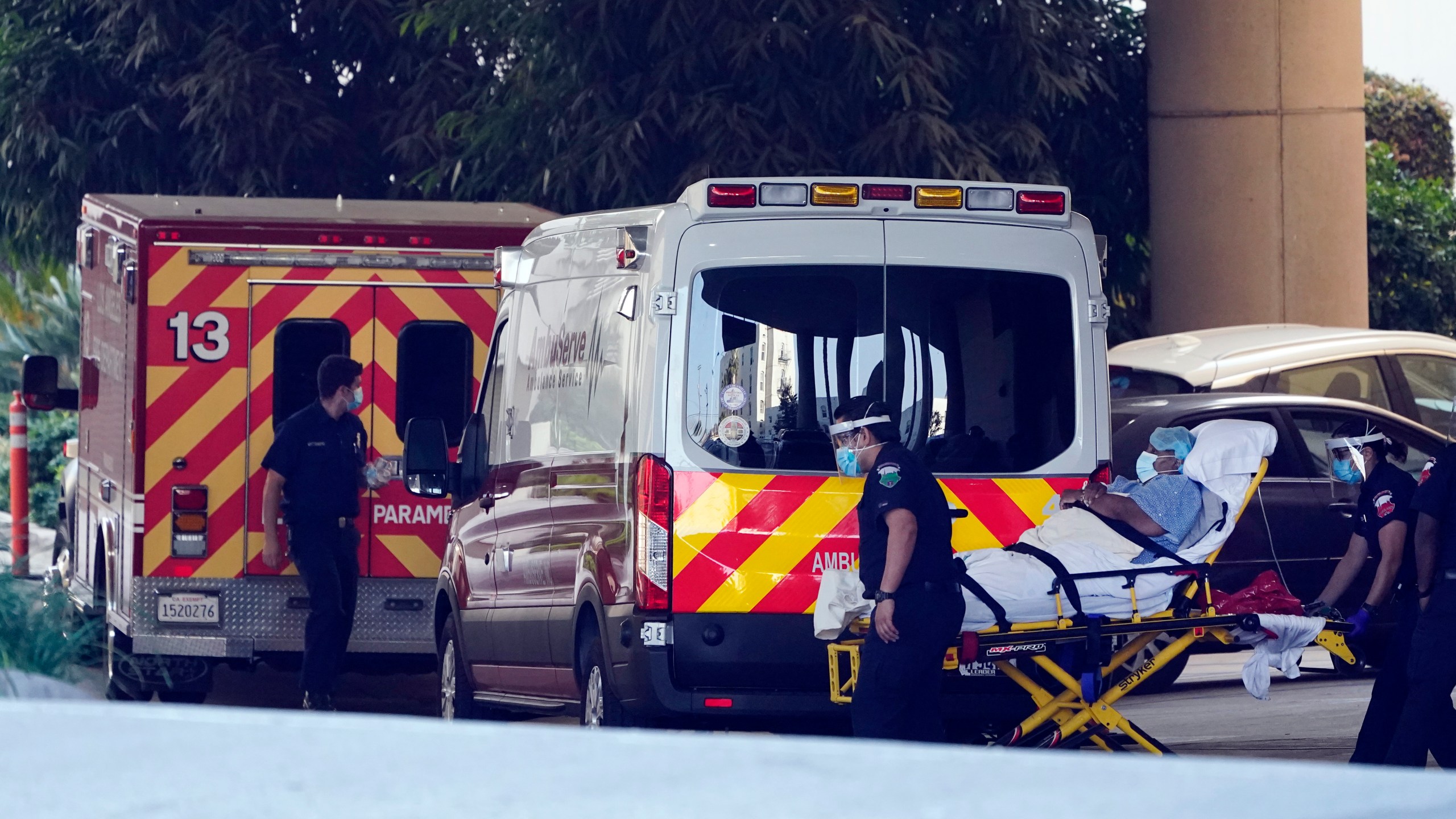 A patient is loaded onto an ambulance outside of the emergency entrance to PIH Health Good Samaritan Hospital Tuesday, Jan. 5, 2021, in Los Angeles. (Marcio Jose Sanchez/AP Photo)