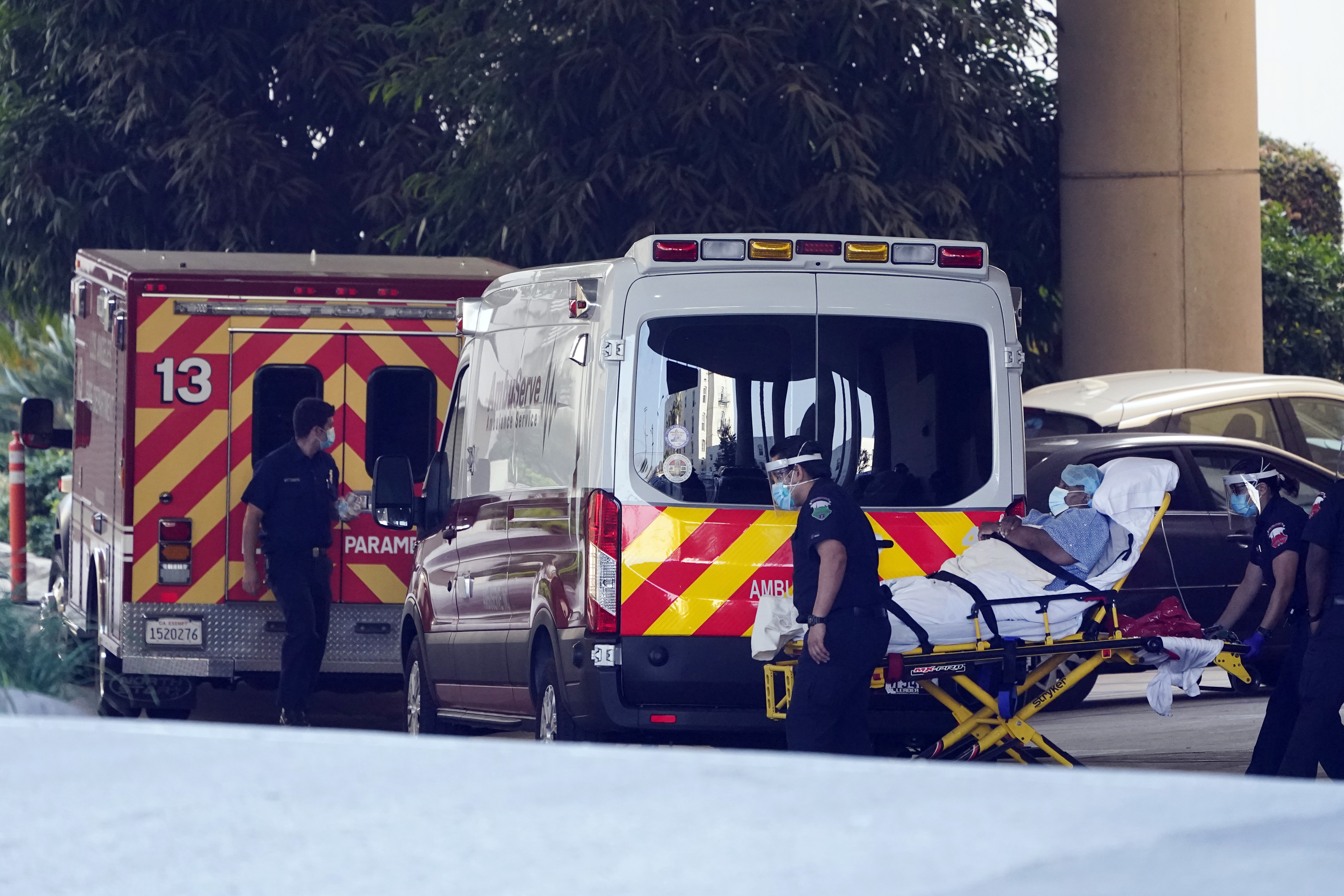 A patient is loaded onto an ambulance outside of the emergency entrance to PIH Health Good Samaritan Hospital Tuesday, Jan. 5, 2021, in Los Angeles. (Marcio Jose Sanchez/AP Photo)