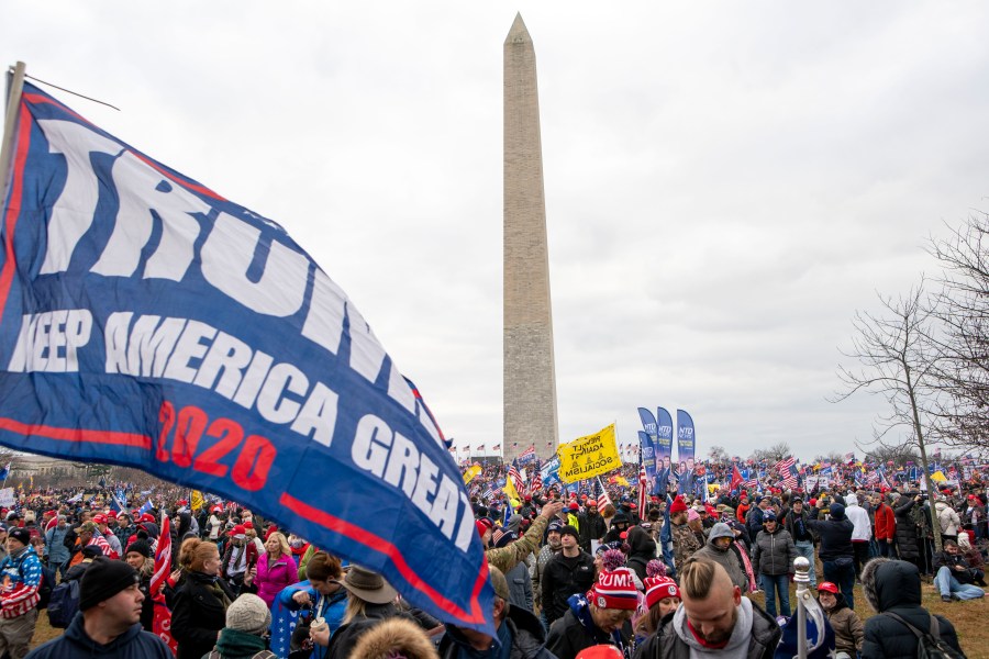 With the Washington Monument in the background, people attend a rally in support of President Donald Trump on Wednesday, Jan. 6, 2021, in Washington. (AP Photo/Jose Luis Magana)