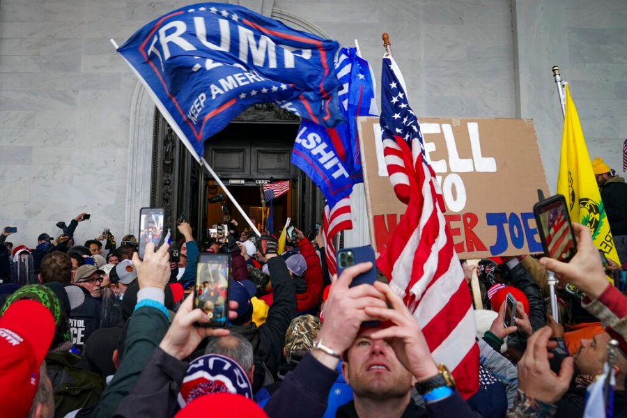 Trump supporters gather outside the Capitol, Wednesday, Jan. 6, 2021, in Washington. (AP Photo/John Minchillo)