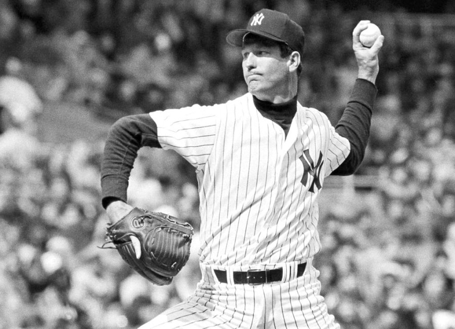 In this 1979 file photo, New York Yankees pitcher Tommy John delivers during a baseball game. (AP Photo/File)