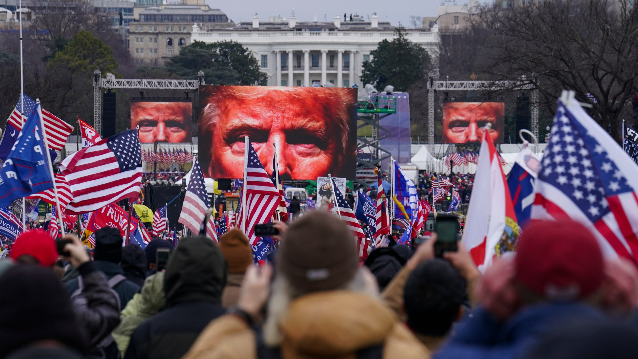 In this Jan. 6, 2021, file photo, Trump supporters participate in a rally in Washington. Far-right social media users for weeks openly hinted in widely shared posts that chaos would erupt at the U.S. Capitol while Congress convened to certify the election results. (AP Photo/John Minchillo)