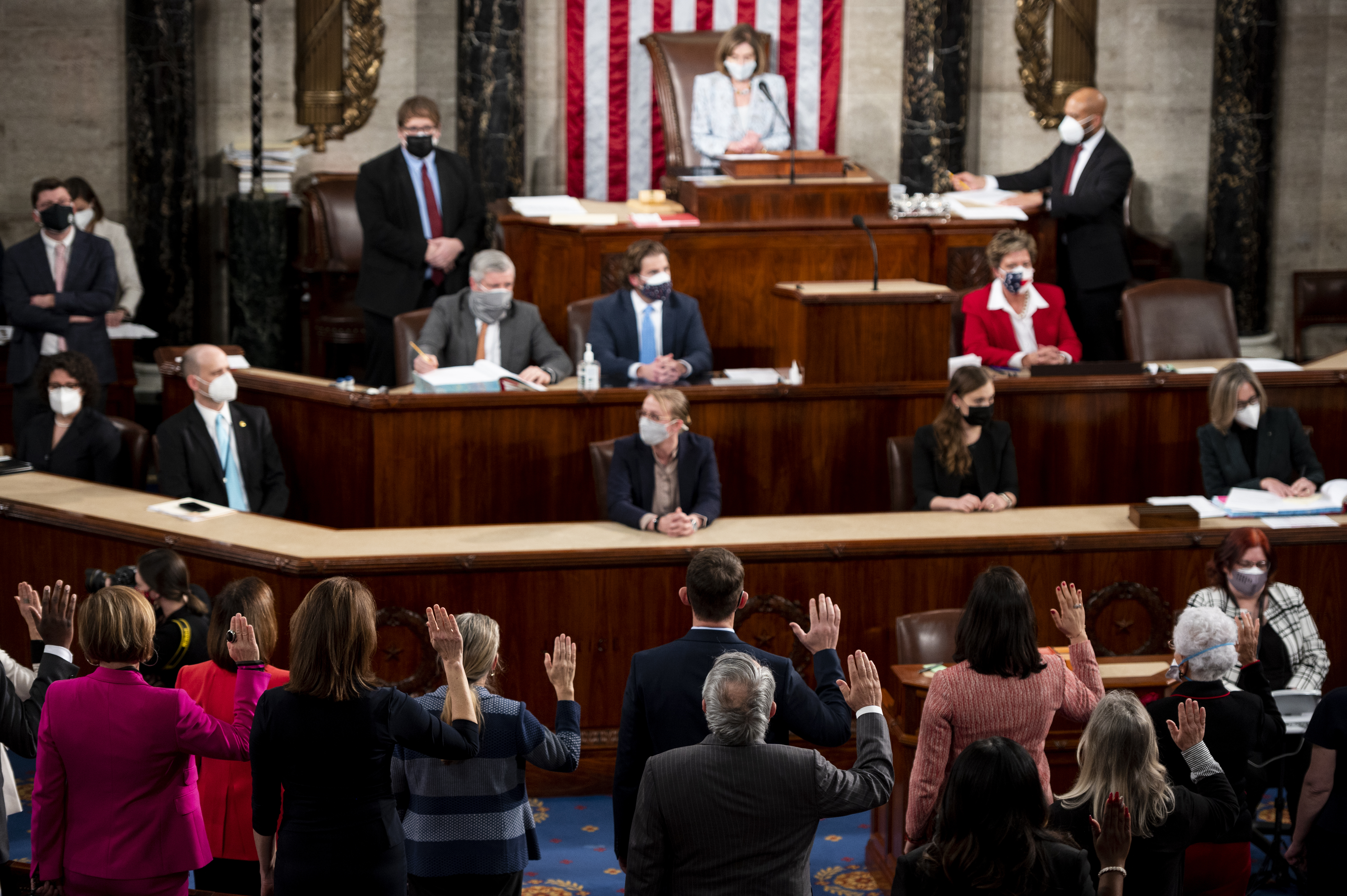 In this Jan. 3, 2021, file photo, House Speaker Nancy Pelosi administers the oath of office to members of the 117th Congress at the U.S. Capitol in Washington. (Bill Clark/Pool Photo via AP, File)