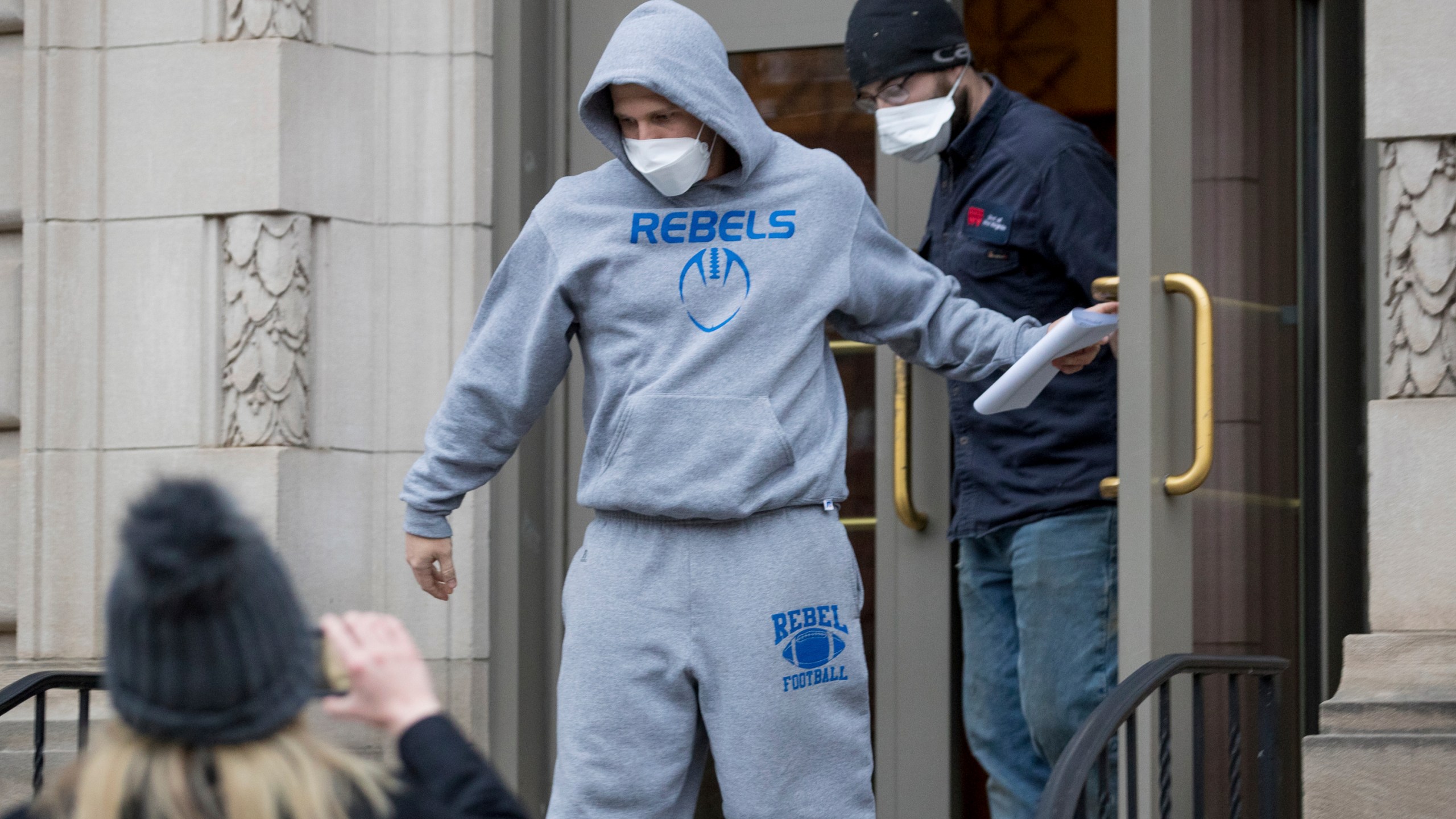 West Virginia Republican state Del. Derrick Evans exits the Sidney L. Christie U.S. Courthouse and Federal Building after being arraigned, Friday, Jan. 8, 2021, in Huntington, West Virginia. (Sholten Singer/The Herald-Dispatch via AP)