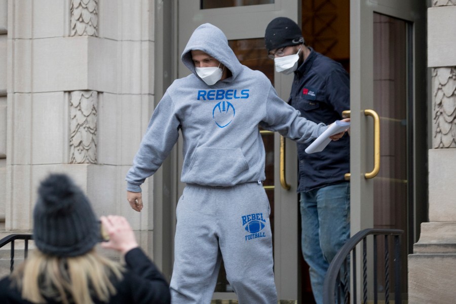 West Virginia Republican state Del. Derrick Evans exits the Sidney L. Christie U.S. Courthouse and Federal Building after being arraigned, Friday, Jan. 8, 2021, in Huntington, West Virginia. (Sholten Singer/The Herald-Dispatch via AP)