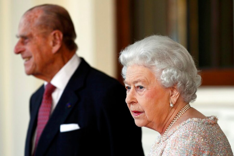 In this Thursday, Nov. 3, 2016 file photo, Britain's Prince Philip and Queen Elizabeth II are seen at Buckingham Palace in London. (Stefan Wermuth/Pool Photo via AP, File)