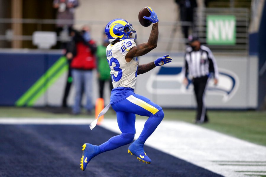 Los Angeles Rams running back Cam Akers reacts after scoring on a 5-yard run against the Seattle Seahawks during the first half of an NFL wild-card playoff football game on Jan. 9, 2021, in Seattle. (AP Photo/Scott Eklund)