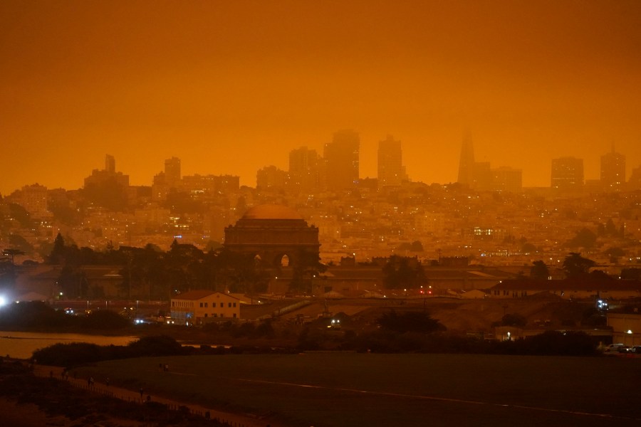 In this Sept. 9, 2020, file photo, the San Francisco skyline in the distance behind Crissy Field is barely visible due to smoke from wildfires burning across California. (Eric Risberg/Associated Press)