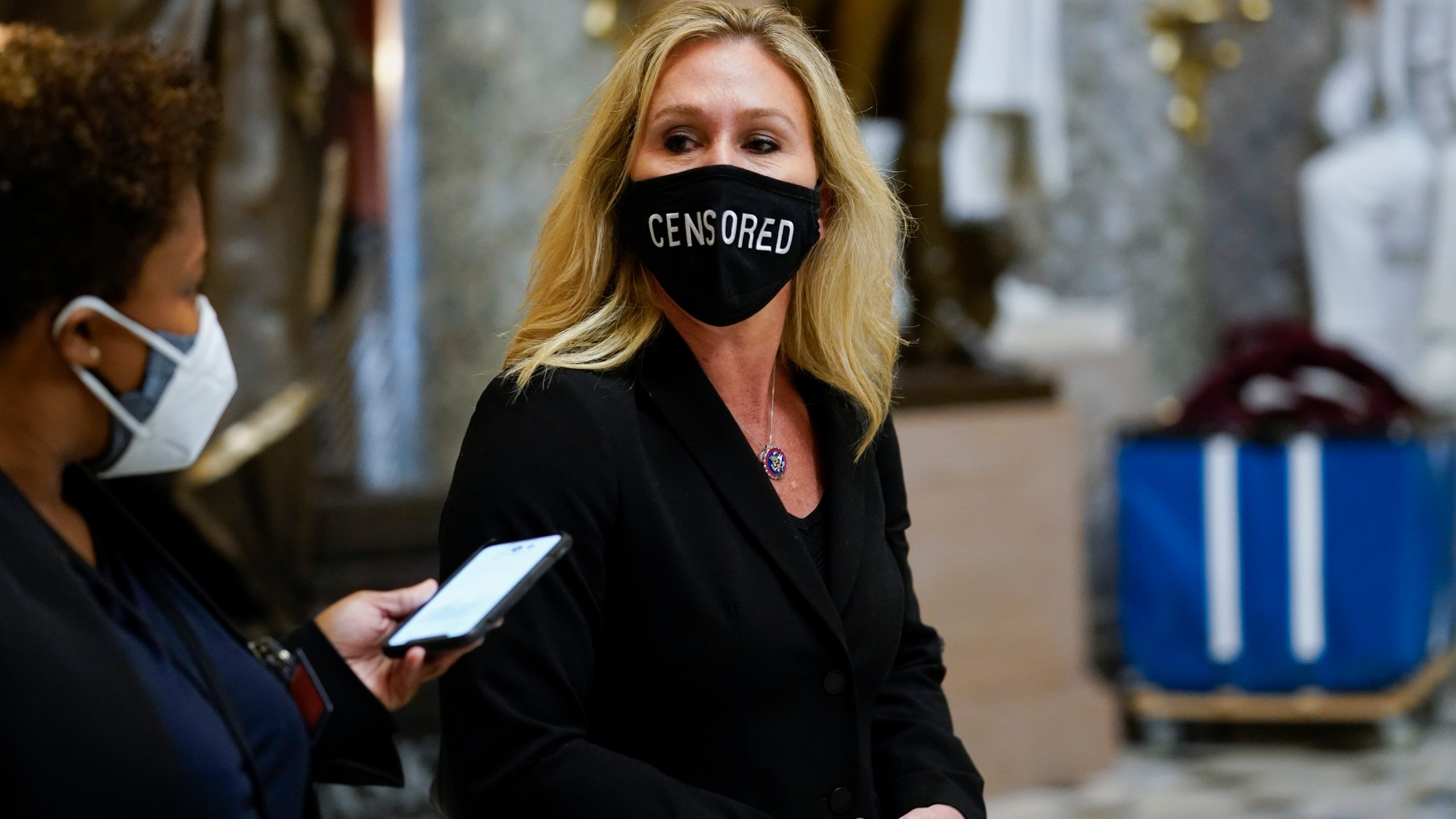 Rep. Marjorie Taylor Greene, R-Ga., walks on Capitol Hill in Washington, Wednesday, Jan. 13, 2021. (AP Photo/Susan Walsh)