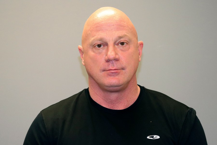 This undated photo provided by the Grapevine Texas Police Department shows, Larry Rendall Brock Jr. During the deadly riot at the U.S. Capitol on Wednesday, Jan. 6, 2021, Brock was photographed on the Senate floor wearing a helmet and heavy vest and carrying zip-tie handcuffs. The retired Air Force officer was arrested in Texas and charged Sunday, Jan. 10 in federal court in the District of Columbia. (GrapevineTexas Police Department via AP)