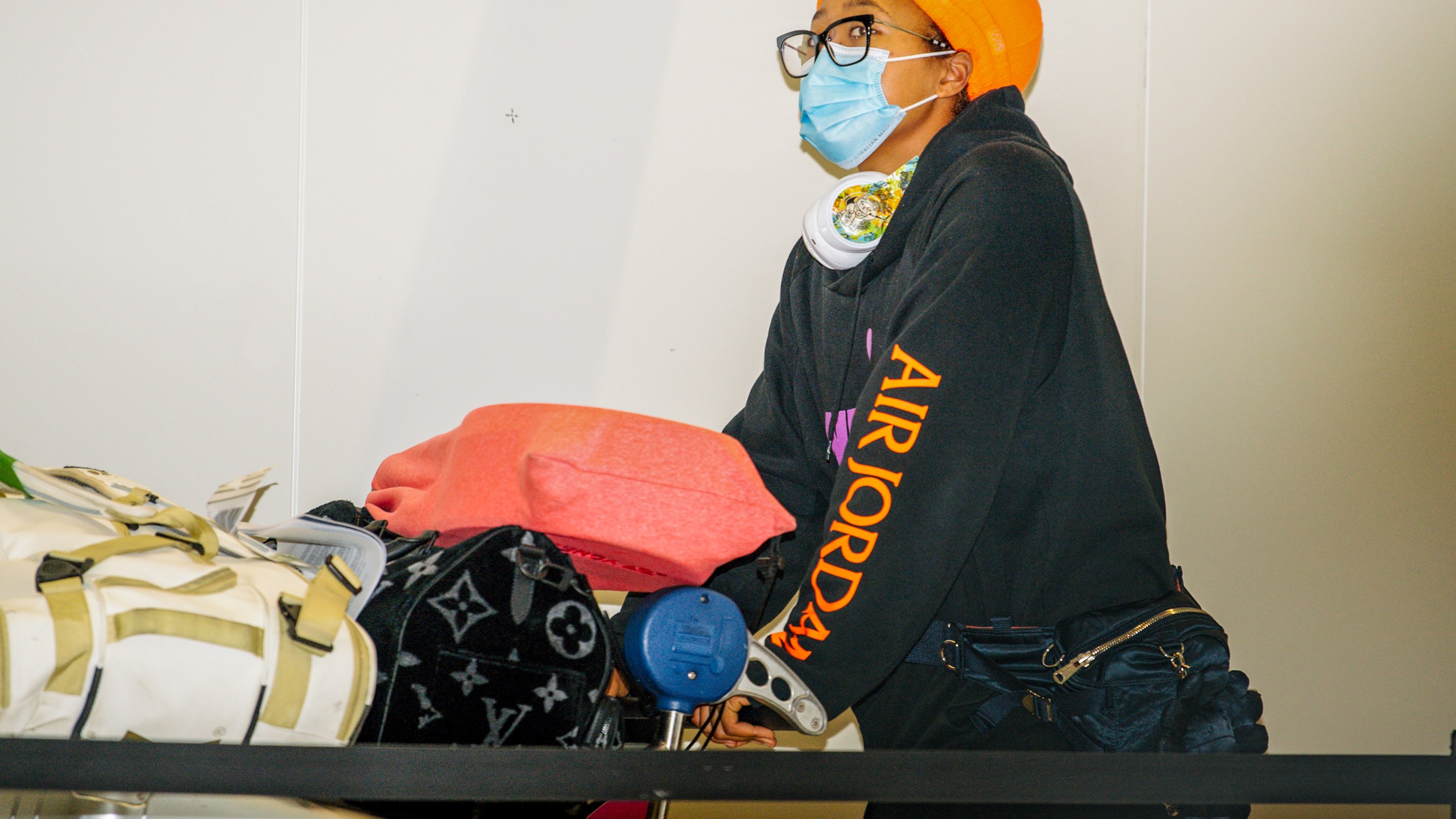 Japan's Naomi Osaka arrives at Adelaide Airport ahead of the Australian Open tennis championship, Adelaide, Australia, Thursday, Jan. 14, 2021. (Morgan Sette/AAP Image via AP)