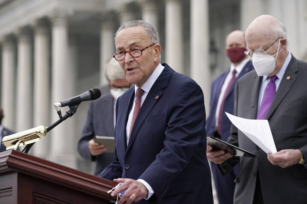 In this Oct. 22, 2020, file photo Senate Minority Leader Chuck Schumer, D-N.Y., and Democratic members of the Senate Judiciary Committee hold a news conference after boycotting the vote by the Republican-led panel to advance the nomination of Judge Amy Coney Barrett to sit on the Supreme Court at the Capitol in Washington. (AP Photo/J. Scott Applewhite, File)