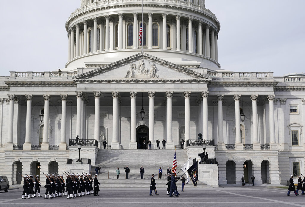 U.S. military units march in front of the Capitol, Monday, Jan. 18, 2021 in Washington, as they rehearse for President-elect Joe Biden's inauguration ceremony, which will be held at the Capitol on Wednesday. (AP Photo/J. Scott Applewhite)