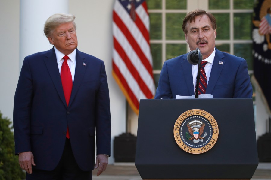 In this March 30, 2020 file photo, My Pillow CEO Mike Lindell speaks as President Donald Trump listens during a briefing about the coronavirus in the Rose Garden of the White House, in Washington. (AP Photo/Alex Brandon, File)