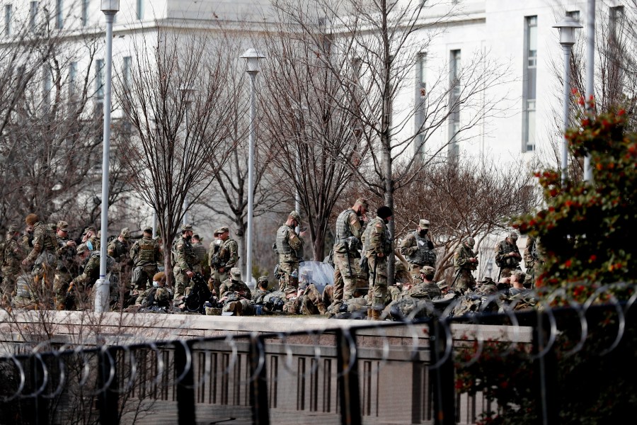 Images of National Guard soldiers camped in a cold parking garage after being sent to protect Washington sparked new calls Friday for investigations of the U.S. Capitol Police, now facing allegations that the agency evicted troops sent to help after its failure to stop rioting mobs two weeks ago. Members of both parties were irate about reports that Guardsmen were forced to take rest breaks outside the Capitol building. About 25,000 Guard members from across the country deployed to help secure President Joe Biden's inauguration, which went off with only a handful of minor arrests. A jittery Washington requested the aid following the riot where police were badly outnumbered, locking down the nation's capital with soldiers, police and barricades and lawmakers and Biden took pains to thank security forces for their effort. All 25,000 Guard members were vetted by the FBI over concerns of an insider attack, and a dozen were removed from their posts including two who made extremist statements about the inauguration. The National Guard said it originally moved troops out of the Capitol Rotunda and other spaces to garages at the behest of the Capitol Police. The Guardsmen were allowed back inside late Thursday after reports were widely shared of the conditions in the garages, with few bathrooms and little covering from the cold. Capitol Police Interim Chief Yogananda Pittman issued a statement Friday saying her agency “did not instruct the National Guard to vacate the Capitol Building facilities.” But two Capitol Police officers who spoke on condition of anonymity contradicted her statement, saying they were told department higher-ups had ordered the Guardsmen out. It was unclear why. The two officers spoke on condition of anonymity because they were not authorized by the department to speak. Sen. Jim Inhofe, R-Okla., said that “multiple members of military leadership” had told him a uniformed Capitol Police officer told them to leave the Capitol Visitor Center. “The troops didn't move on their own,” said Inhofe, the top Republican on the Senate Armed Services Committee. He added: “This isn’t a blame game, but I want to know what happened so we can make sure it can’t happen again.” Rep. Tim Ryan, D-Ohio, who leads a subcommittee that oversees the Capitol Police budget, said Pittman and other commanders would eventually need to testify about their decision-making. “If the Capitol Police in any way, shape, or form pushed the Guard out into a cold garage, then there’s going to be hell to pay,” Ryan said . “We’re already trying to re-establish trust with the Capitol Police and we’ve got to figure out exactly what happened.” The National Guard Bureau said Thursday that of the nearly 26,000 Guard troops deployed to D.C. for the inaugural, just 10,600 remain on duty. The bureau said the Guard is helping states with coordination and the logistics so that troops can get home. Thousands of Guard troops from all across the country poured into D.C. by the planeload and busload late last week, in response to escalating security threats and fears of more rioting. Military aircraft crowded the runways at Joint Base Andrews in Maryland, carrying Guard members into the region in the wake of the deadly Jan. 6 insurrection at the U.S. Capitol. Guard forces were scattered around the city, helping to secure the Capitol, monuments, Metro entrances and the perimeter of central D.C., which was largely locked down for several days leading up to Wednesday’s inaugural ceremony. Some local law enforcement agencies have asked for continued assistance from the Guard, so roughly 7,000 troops are expected to stay in the region through the end of the month. The insurrection highlighted multiple failures by the Capitol Police to prepare for what became a violent mob overrunning parts of the building. Officers who spoke to The Associated Press on condition of anonymity said there was little planning before the riot or guidance from department leaders once the riot began. The riot left five people dead, including Capitol Police Officer Brian Sicknick, who was hit in the head by a fire extinguisher. Another officer died in an apparent suicide after the attack.