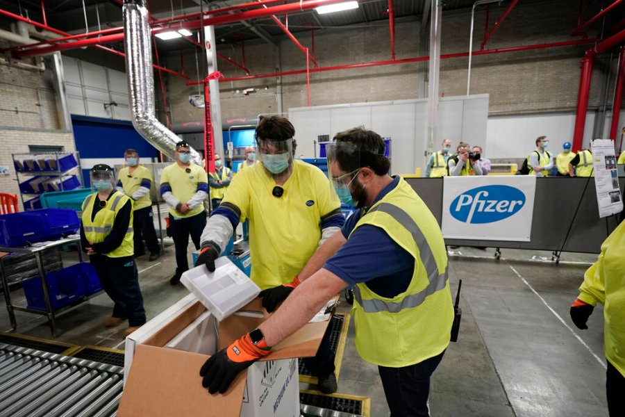 In this Dec. 13, 2020 file photo, Boxes containing the Pfizer-BioNTech COVID-19 vaccine are prepared to be shipped at the Pfizer Global Supply Kalamazoo manufacturing plant in Portage, Mich. (AP Photo/Morry Gash, Pool, File)