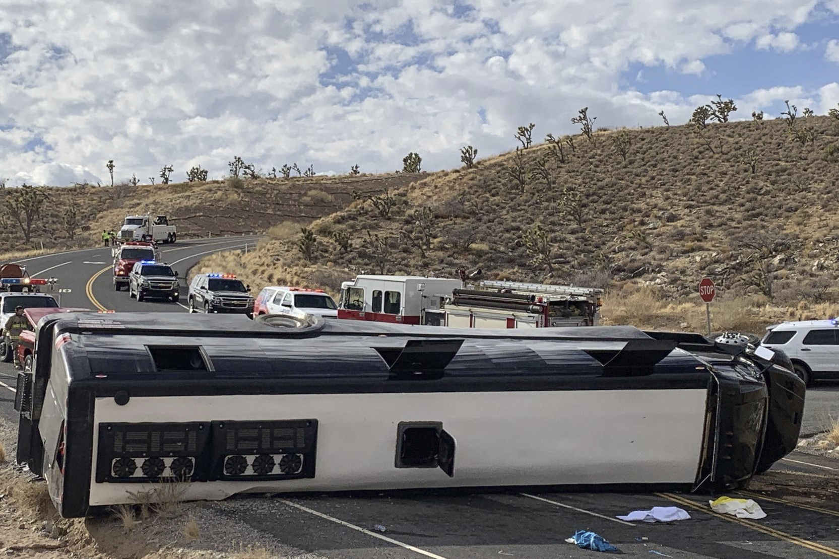 This photo provided by the Mohave County Sheriff's Office shows a Las Vegas-based tour that rolled over in northwestern Arizona on Friday, Jan. 22, 2021. (Mohave County Sheriff's Office via AP)