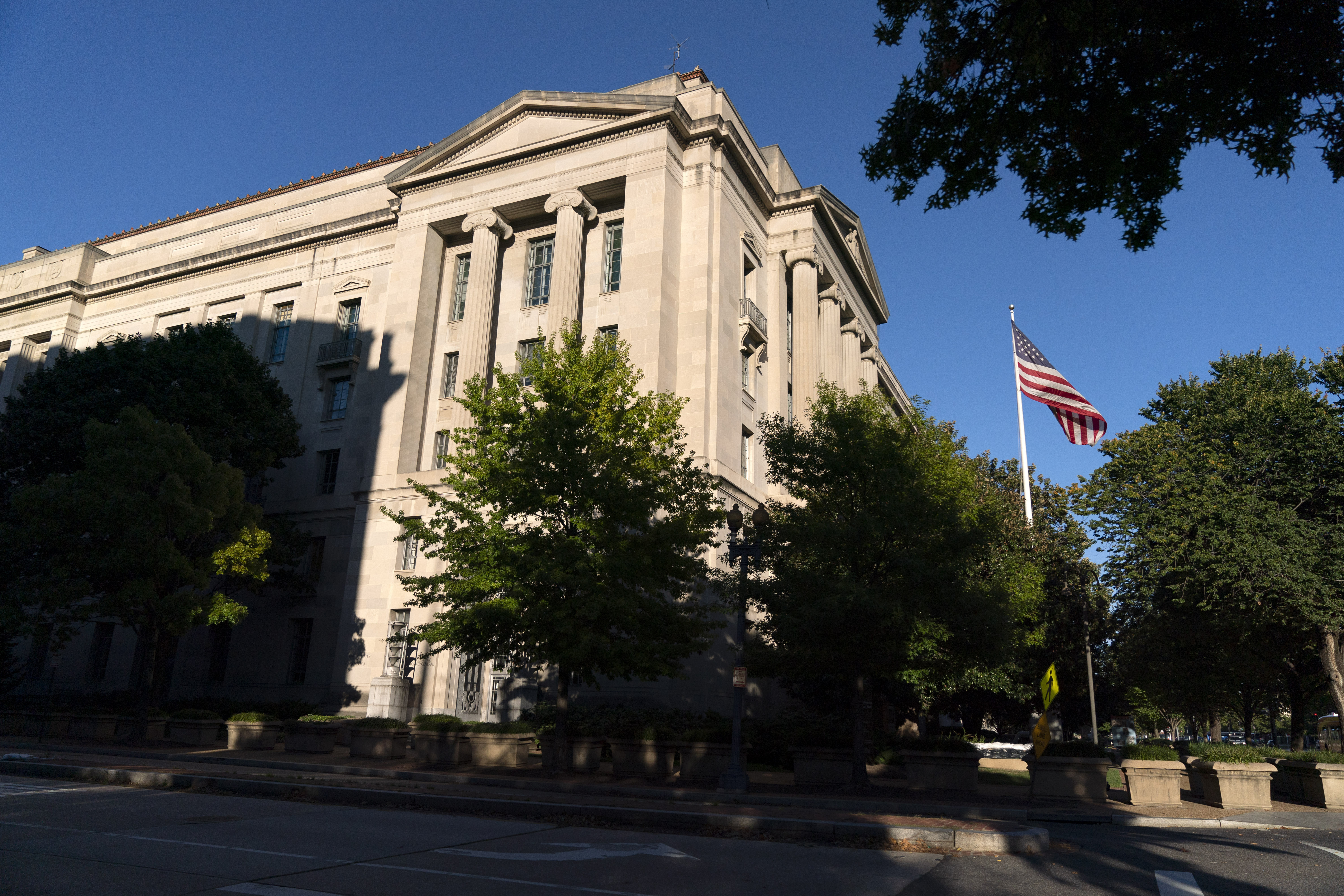 In this Oct. 8, 2020, file photo an American flag flies outside of the Justice Department building in Washington. (AP Photo/Jacquelyn Martin)In this Oct. 8, 2020, file photo an American flag flies outside of the Justice Department building in Washington. (AP Photo/Jacquelyn Martin)