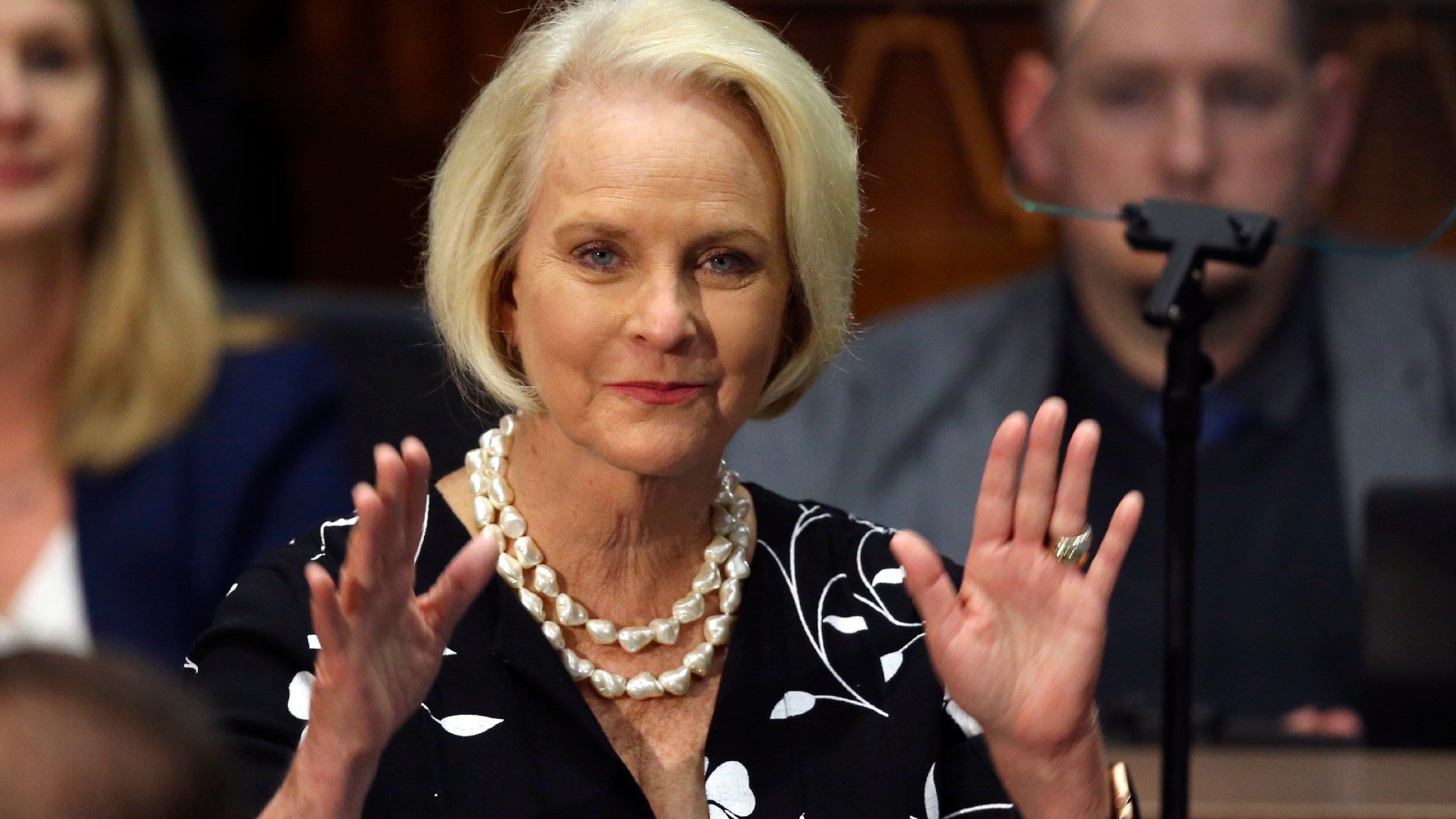 In this Jan. 13, 2020, file photo Cindy McCain, wife of former Arizona Sen. John McCain, waves to the crowd after being acknowledged by Arizona Republican Gov. Doug Ducey during his State of the State address on the opening day of the legislative session at the Capitol in Phoenix. (AP Photo/Ross D. Franklin)