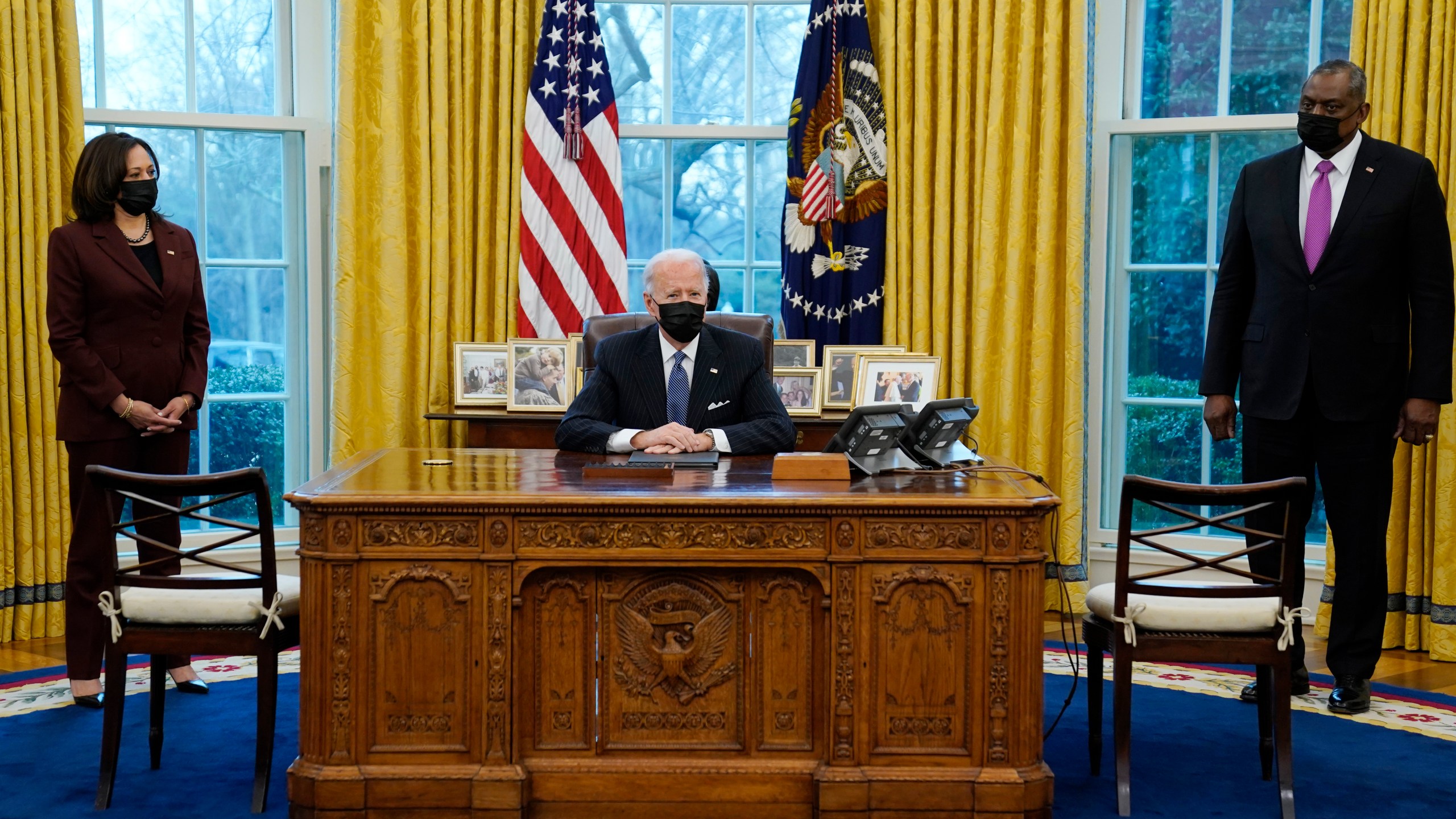 President Joe Biden meets with Secretary of Defense Lloyd Austin, Vice President Kamala Harris, in the Oval Office of the White House, Monday, Jan. 25, 2021, in Washington. (AP Photo/Evan Vucci)