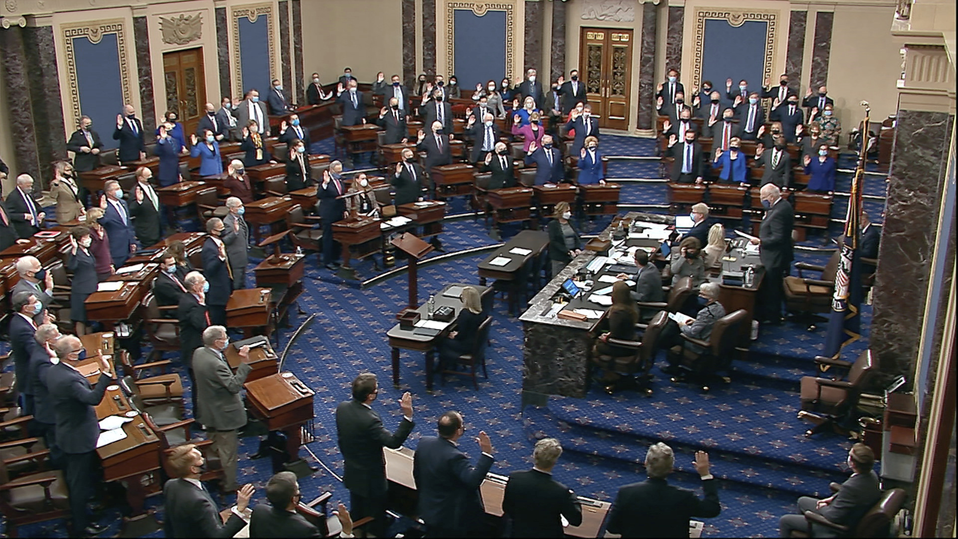 In this image from video, Sen. Patrick Leahy, D-Vt., the president pro tempore of the Senate, swears in members of the Senate for the impeachment trial at the U.S. Capitol on Jan. 26, 2021. (Senate Television via Associated Press)