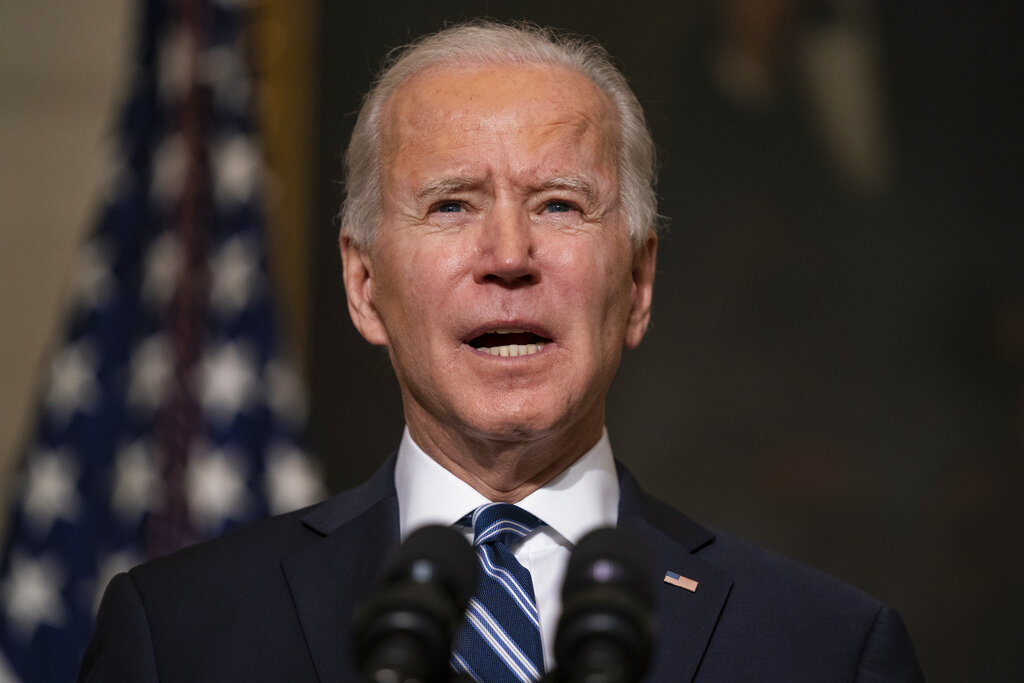 In this Jan. 27, 2021, photo, President Joe Biden speaks in the State Dining Room of the White House in Washington.