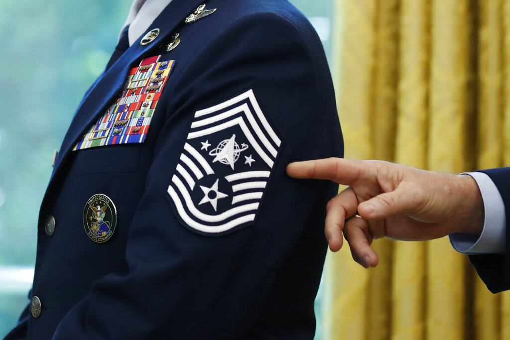 In this May 15, 2020, file photo, Chief Master Sgt. Roger Towberman displays his insignia during a presentation of the United States Space Force flag in the Oval Office of the White House in Washington. (AP Photo/Alex Brandon, File)