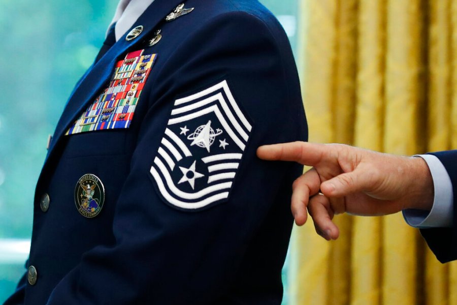 In this May 15, 2020, file photo, Chief Master Sgt. Roger Towberman displays his insignia during a presentation of the United States Space Force flag in the Oval Office of the White House in Washington. (AP Photo/Alex Brandon, File)