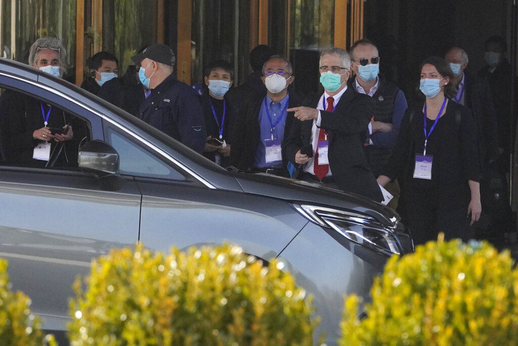 Members of the World Health Organization team of researchers prepare to leave on a field trip in Wuhan in central China's Hubei province Friday, Jan. 29, 2021.