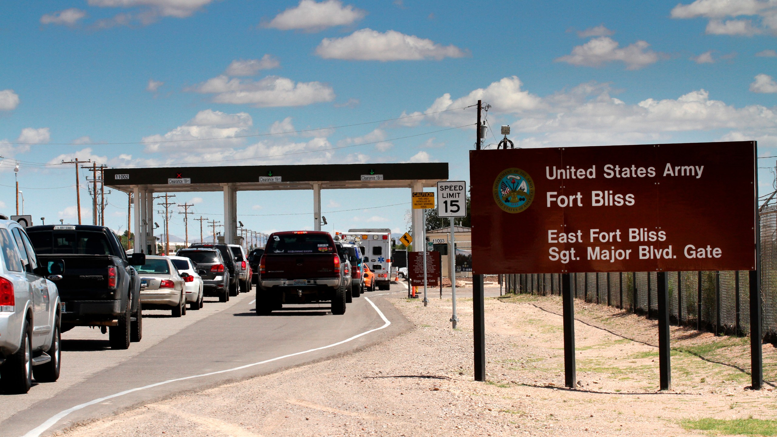 This Sept. 9, 2014 file photo shows cars wait to enter Fort Bliss in El Paso, Texas. (AP Photo/Juan Carlos Llorca)