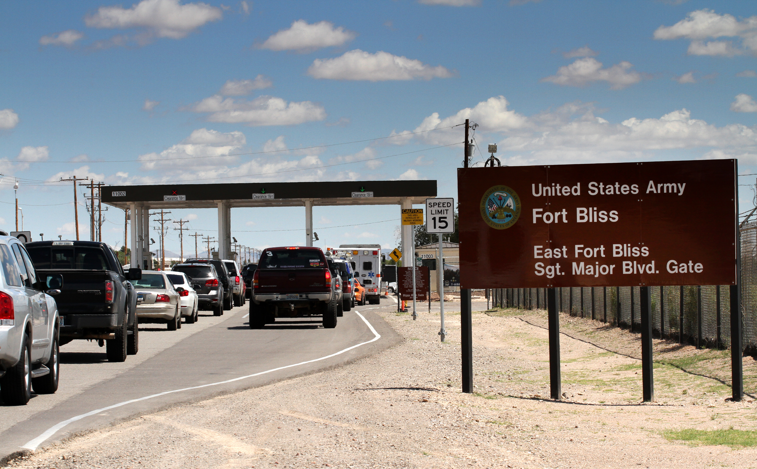 This Sept. 9, 2014 file photo shows cars wait to enter Fort Bliss in El Paso, Texas. (AP Photo/Juan Carlos Llorca)