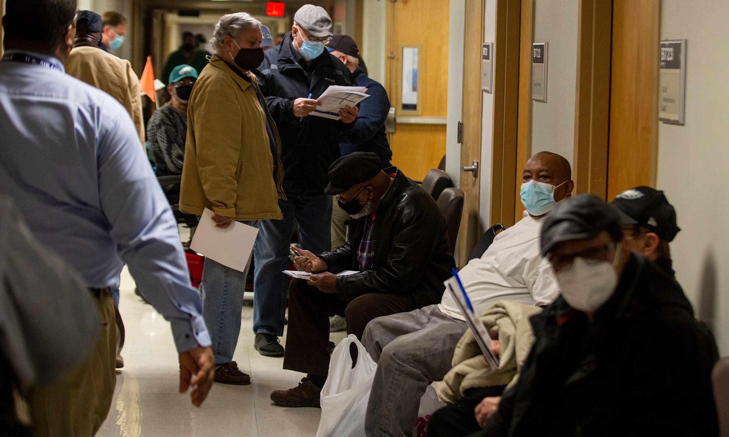 In this Jan. 23, 2021, file photo, veterans wait in line inside the VA Medical Center in Philadelphia to receive the COVID-19 vaccine during a walk-in clinic. (Tyger Williams/The Philadelphia Inquirer via AP)