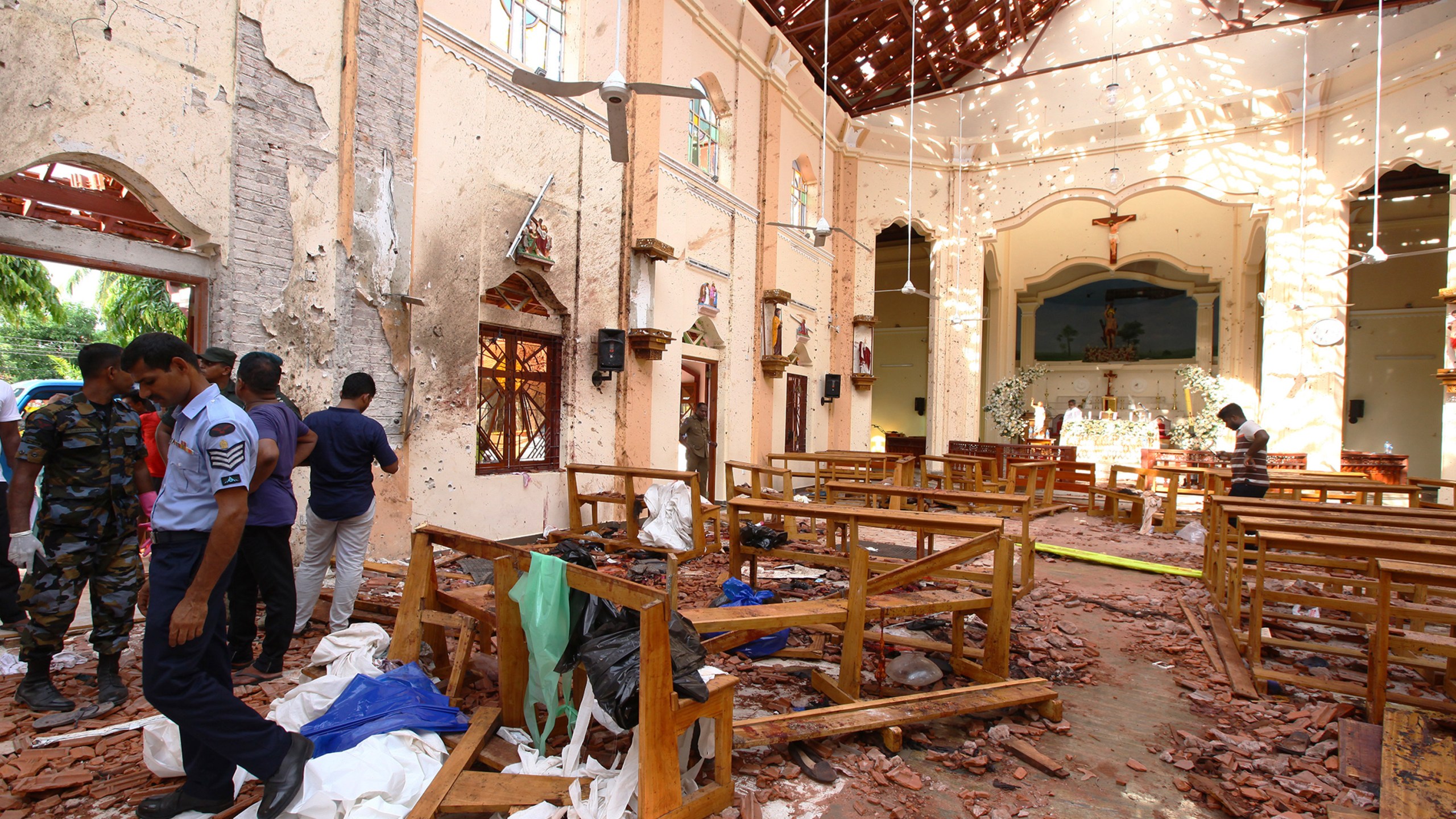 Sri Lankan officials inspect St. Sebastian's Church in Negombo, north of Colombo, after multiple explosions targeting churches and hotels across Sri Lanka on April 21, 2019. (Stringer/Getty Images)