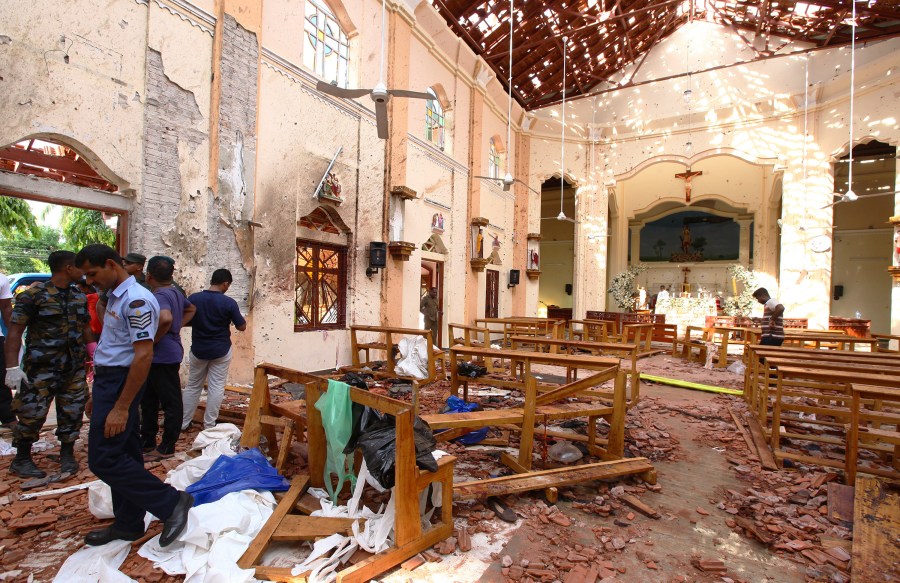 Sri Lankan officials inspect St. Sebastian's Church in Negombo, north of Colombo, after multiple explosions targeting churches and hotels across Sri Lanka on April 21, 2019. (Stringer/Getty Images)