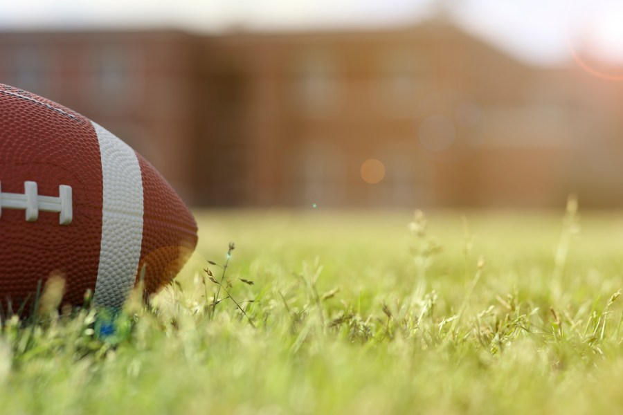 A file photo shows a football on grass. (Getty Images)