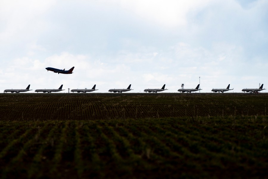 A Southwest Airlines flight takes off as United Airlines planes sit parked on a runway at Denver International Airport as the coronavirus pandemic slows air travel on April 22, 2020 in Denver, Colorado. (Photo by Michael Ciaglo/Getty Images)