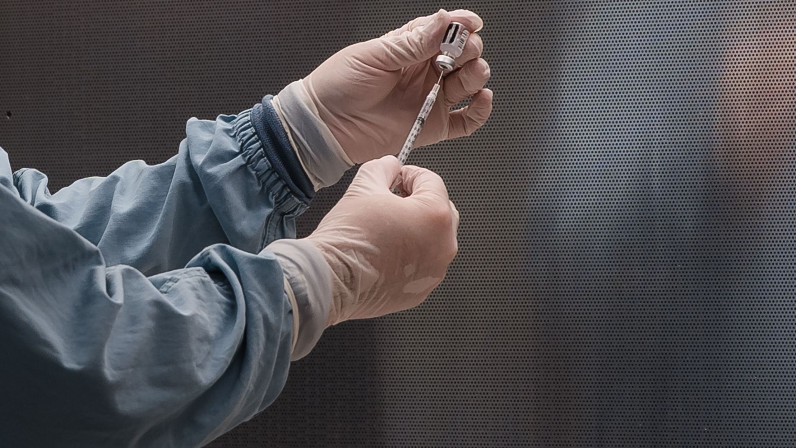 In this file photo, a pharmacy technician prepares Pfizer's COVID-19 vaccine before it is administered at Rady Children's Hospital in San Diego on Dec. 15, 2020. (ARIANA DREHSLER/AFP via Getty Images)