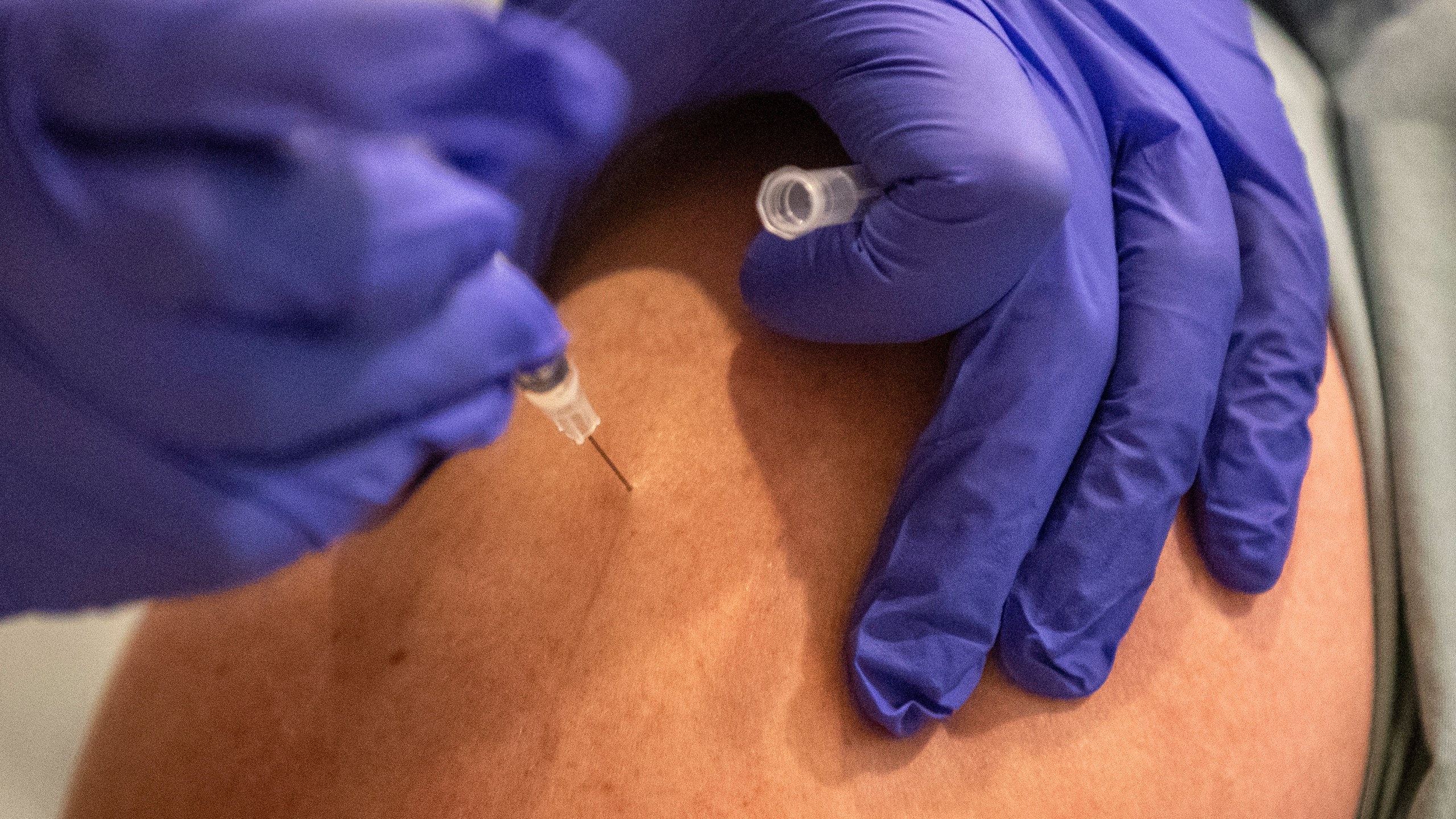 UCLA physician Russell Johnson gets an injection of the COVID-19 vaccine at Ronald Reagan UCLA Medical Center on Dec. 16, 2020 in Westwood, California. ( Brian van der Brug-Pool/Getty Images)