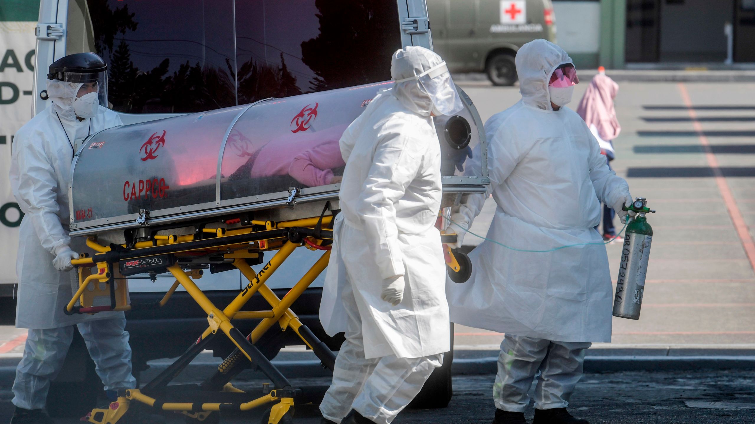 Paramedics move a patient suspected of being infected with the novel coronavirus into the 22 Battalion of the Military Police Hospital, in Mexico City, on December 30, 2020. (Pedro Pardo/AFP via Getty Images)