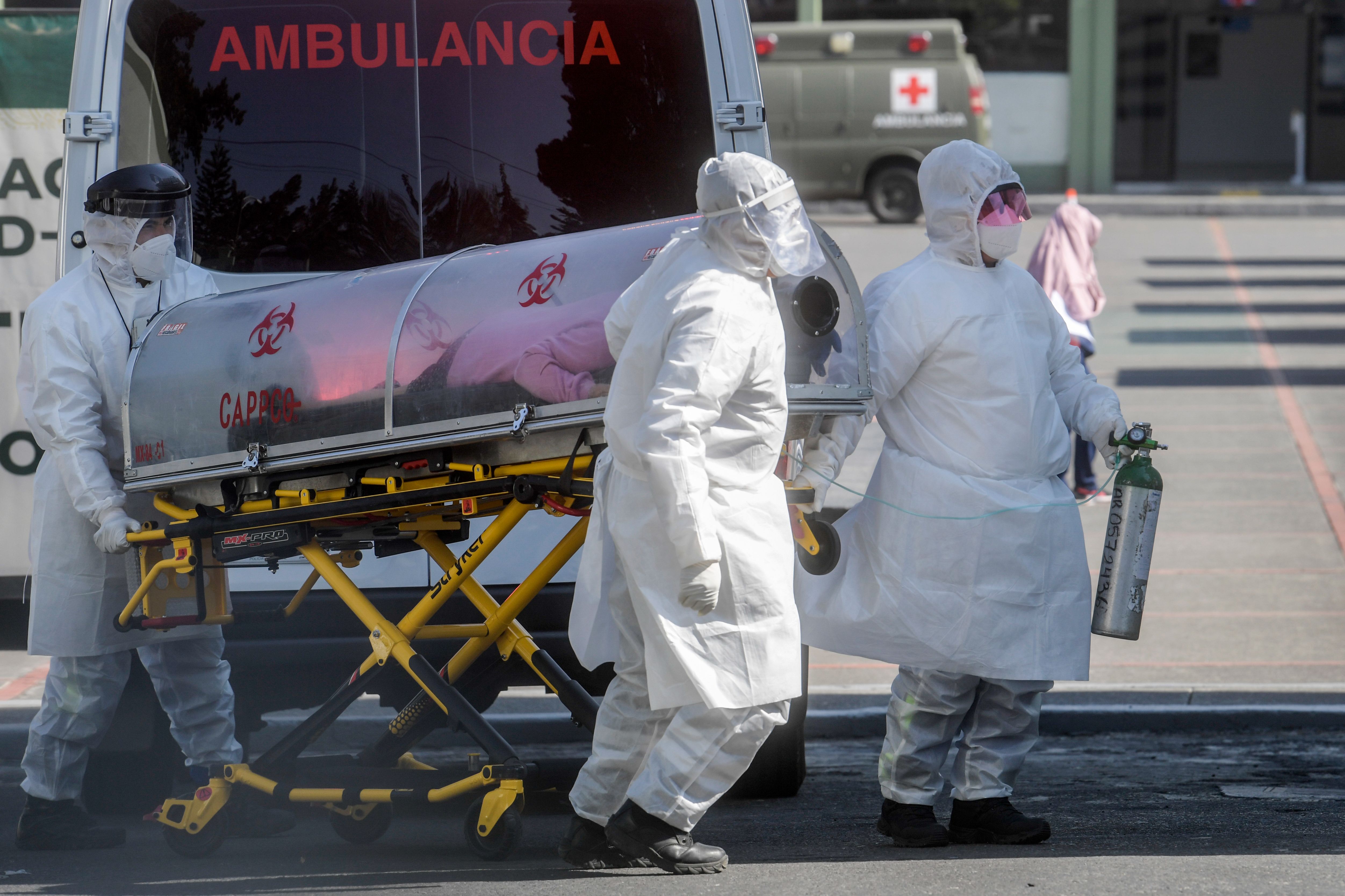 Paramedics move a patient suspected of being infected with the novel coronavirus into the 22 Battalion of the Military Police Hospital, in Mexico City, on December 30, 2020. (Pedro Pardo/AFP via Getty Images)