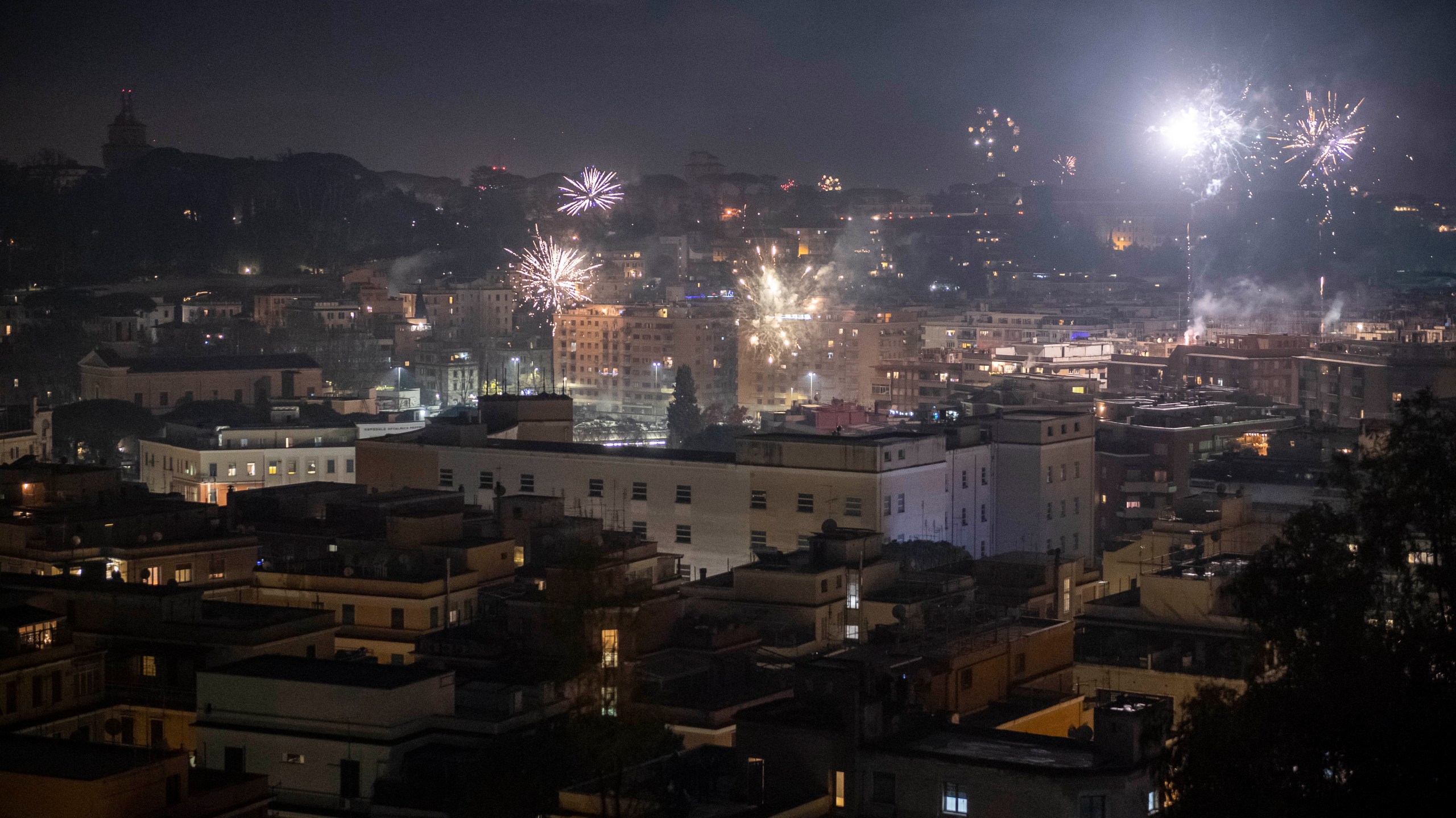 Fireworks are seen over the city of Rome while people celebrate New Year's Eve during the Coronavirus pandemic on January 01, 2021, in Rome, Italy. (Antonio Masiello/Getty Images)