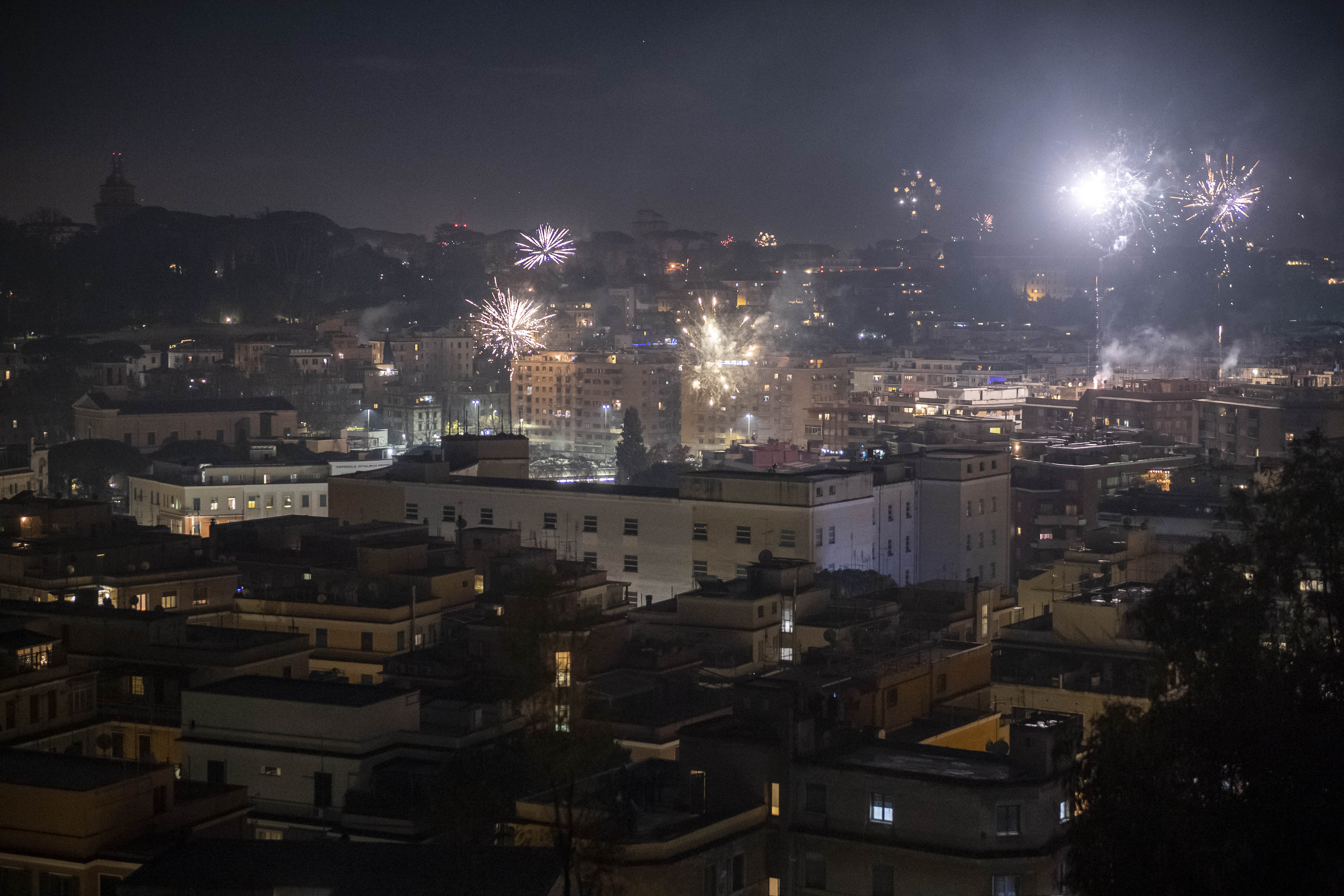 Fireworks are seen over the city of Rome while people celebrate New Year's Eve during the Coronavirus pandemic on January 01, 2021, in Rome, Italy. (Antonio Masiello/Getty Images)