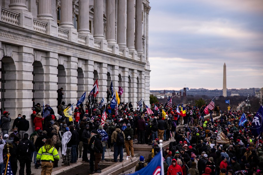 A pro-Trump mob storms the U.S. Capitol following a rally with President Donald Trump on Jan. 6, 2021. (Samuel Corum/Getty Images)