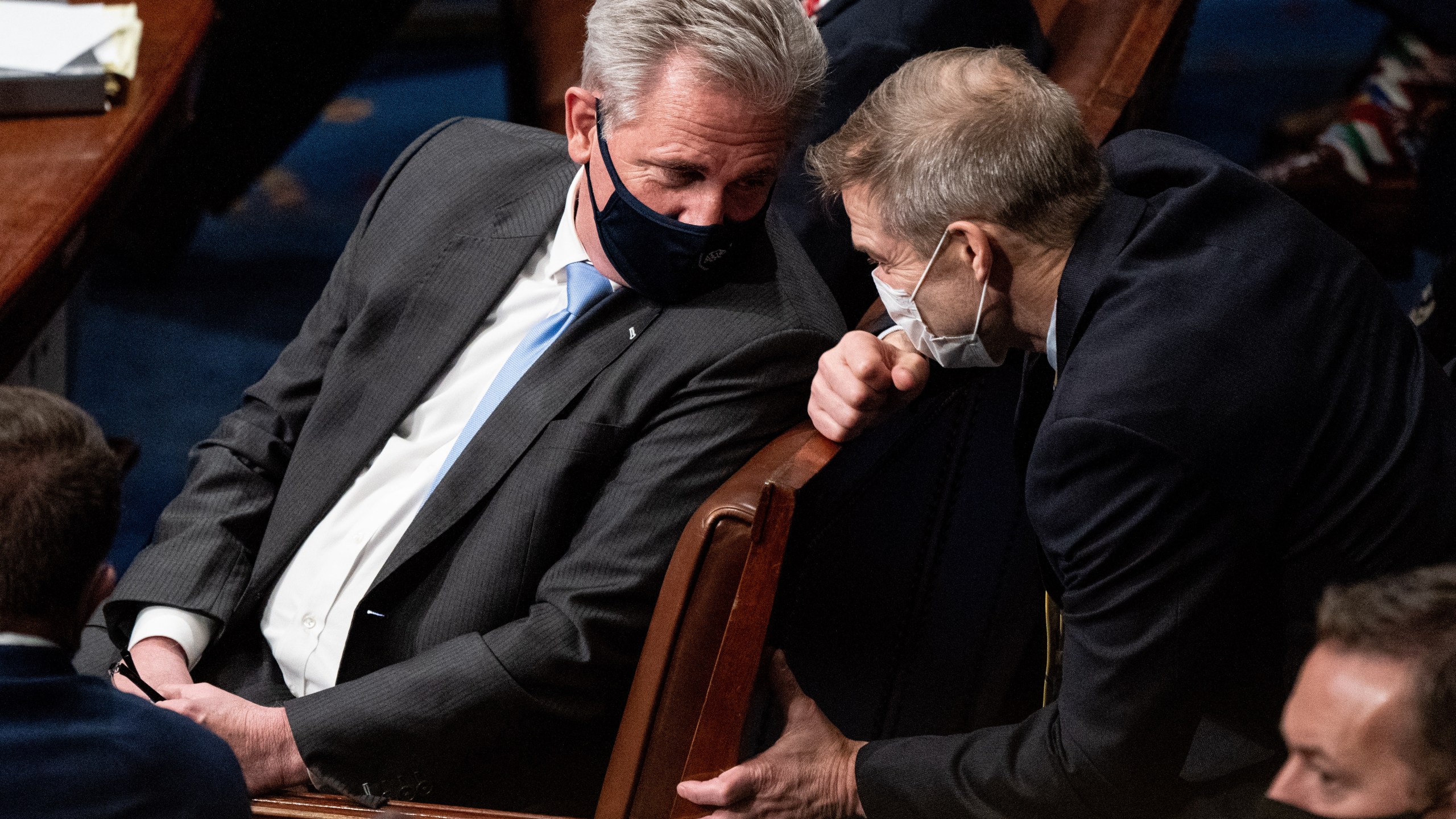 House Minority Leader Kevin McCarthy (R-CA) and Rep. Jim Jordan (R-OH) talk during a joint session of Congress on Jan. 6, 2021 in Washington, DC. Congress has reconvened to ratify President-elect Joe Biden's 306-232 Electoral College win over President Donald Trump, hours after a pro-Trump mob broke into the U.S. Capitol and disrupted proceedings. (Erin Schaff - Pool/Getty Images)